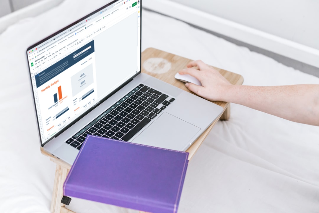 a-person-using-a-laptop-computer-on-a-bed-xjlc-ke3oni